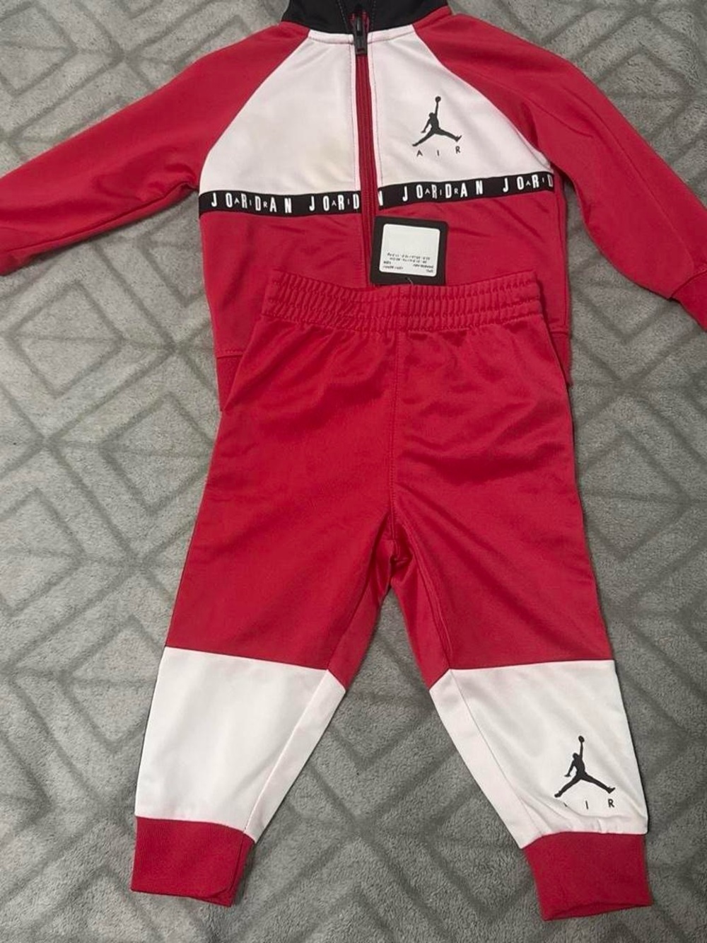Jordan Kids Red and White Track Set with Jumpman Logo, yellow stains never worn